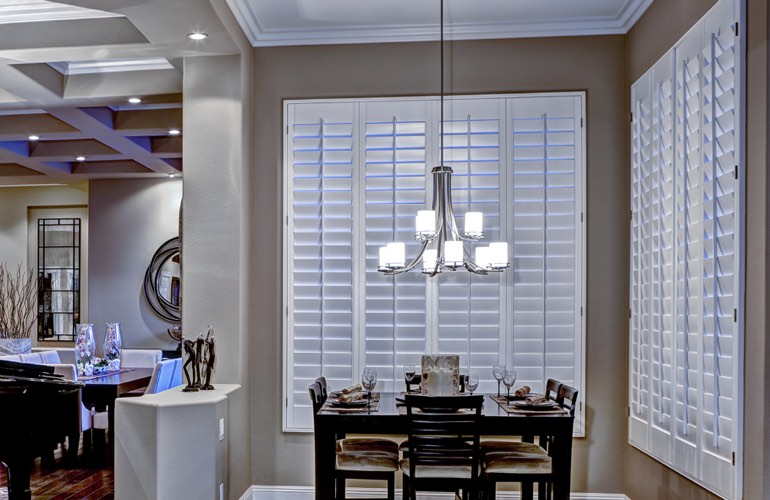 Dining Room Shutters In Charlotte, NC. White plantation shutters in dining room